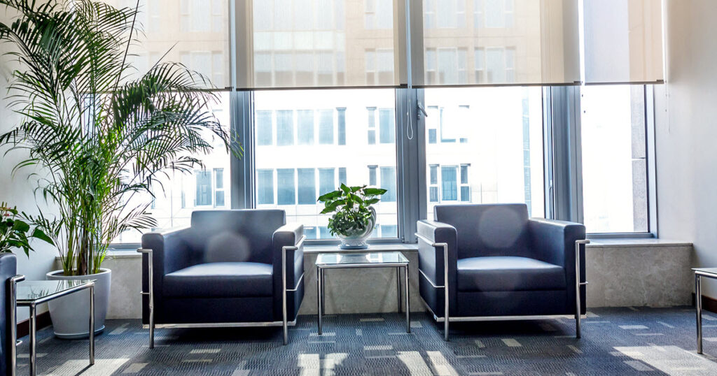 chairs and side tables in the waiting area of a medical practice